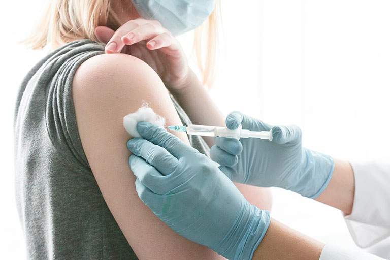 A doctor giving a patient an injection